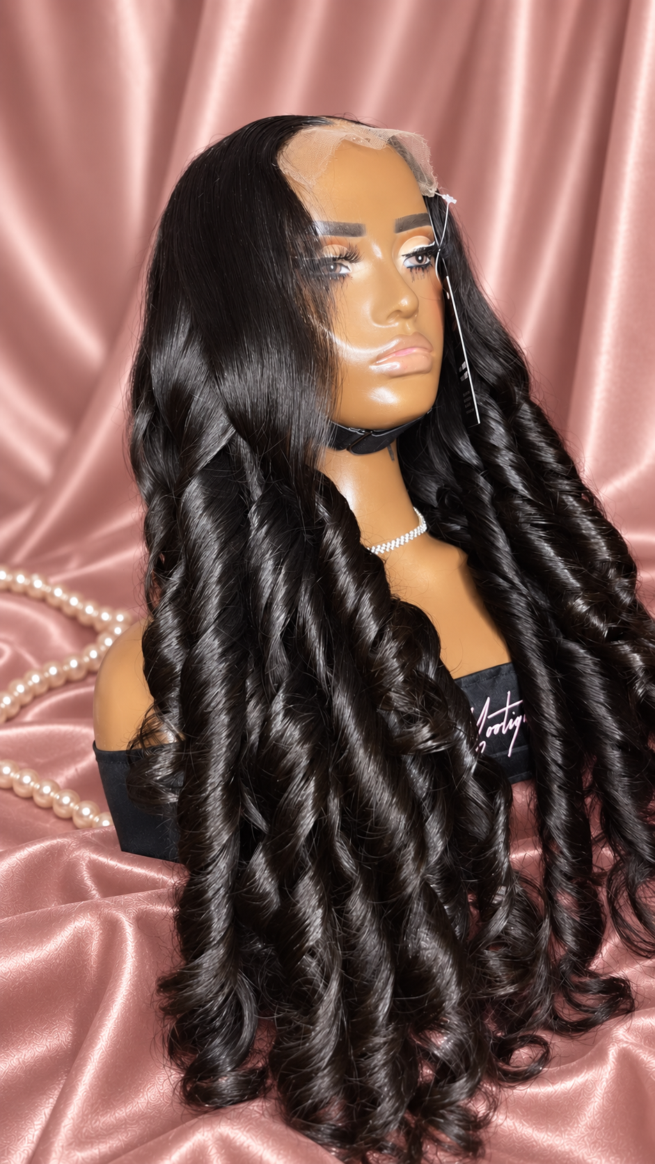 Jasmine black spiral curl wig on rose satin