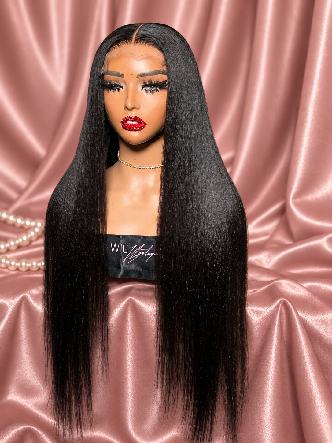 Kinky Straight wig in a pressed style on rose satin, full-length view