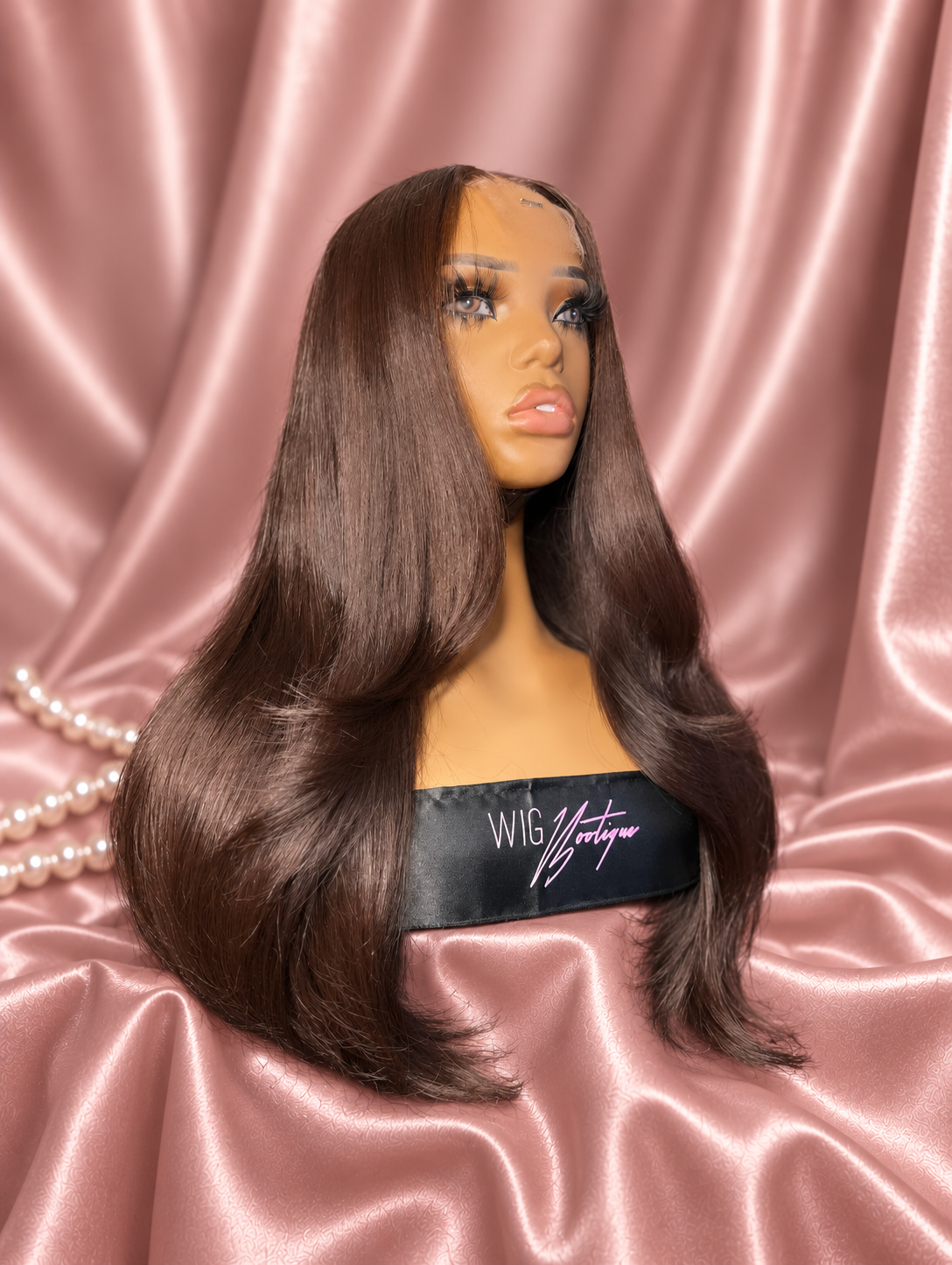Trina chocolate brown wig on rose satin, view 1
